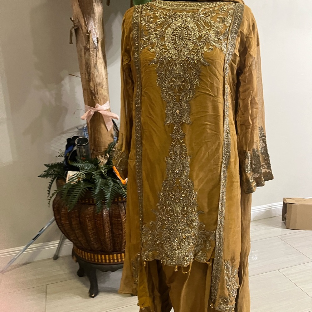 mustard brownish designer set . chifon fabric with stone work.